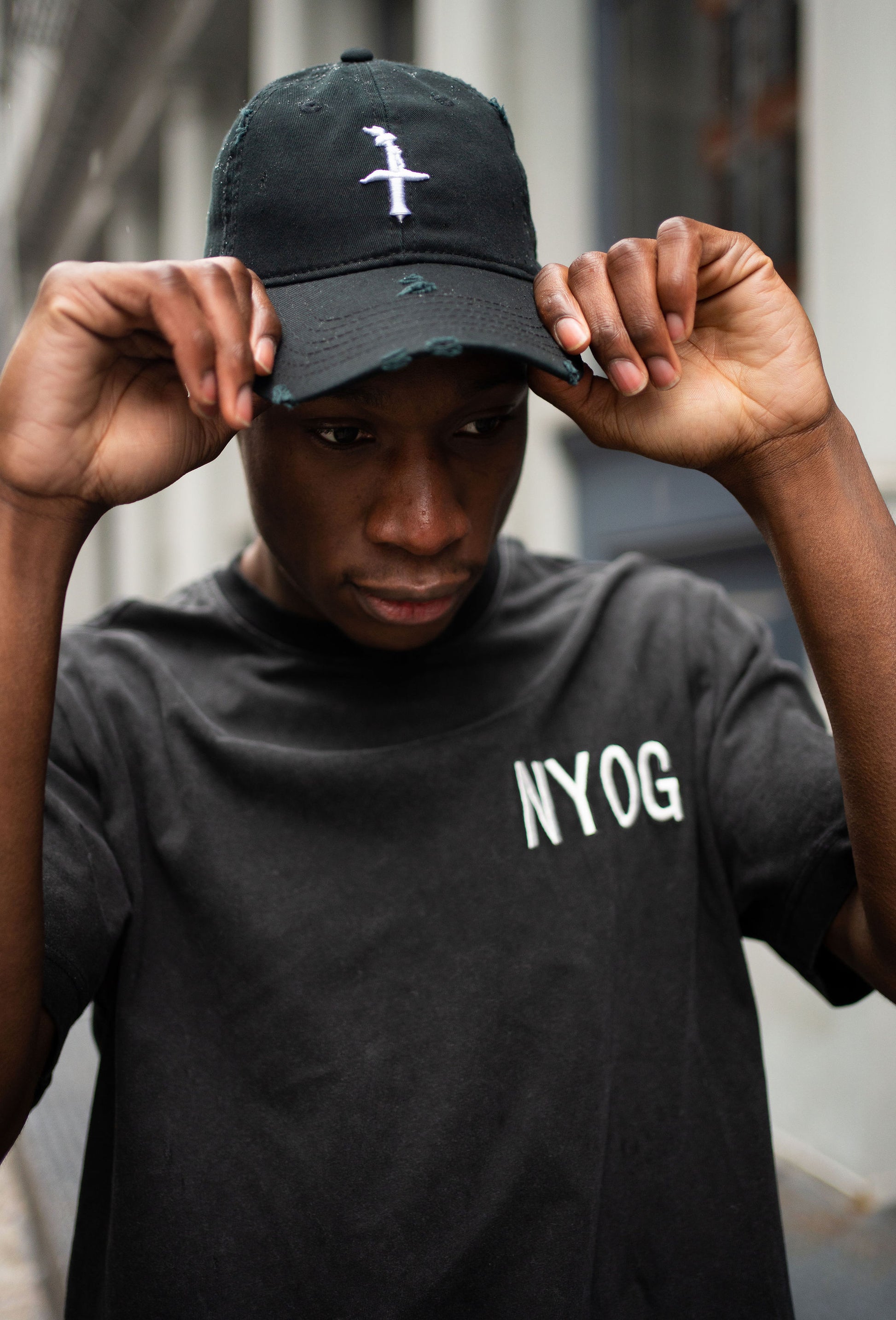 Acid washed gray t-shirt. Relaxed fit with white NYOG embroidered on left chest and born in the apple direct to garment graphic design on back.